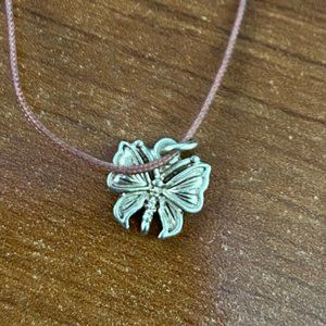 Gold-toned butterfly charm on brown cord necklace